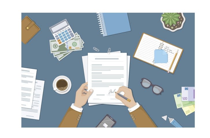 Businessman signing a document