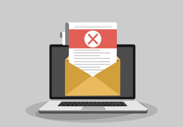 Laptop and envelope with rejected letter
