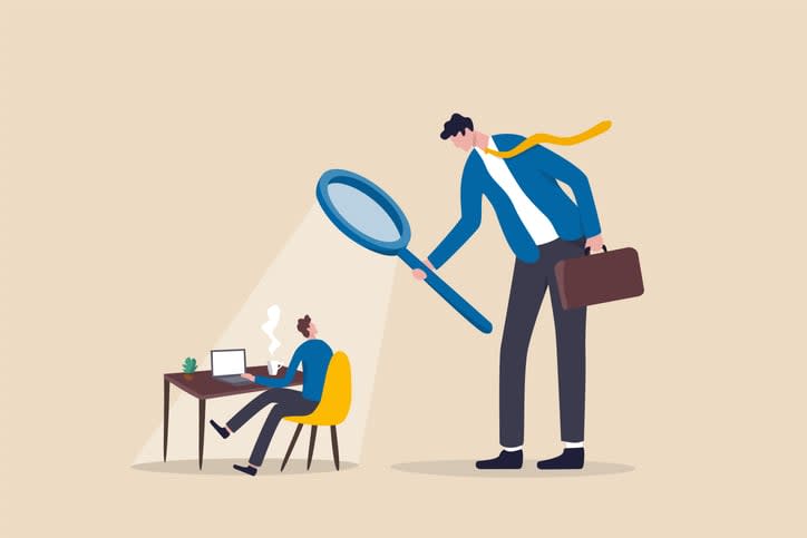 micromanager boss using magnifying glass keep looking at employee working