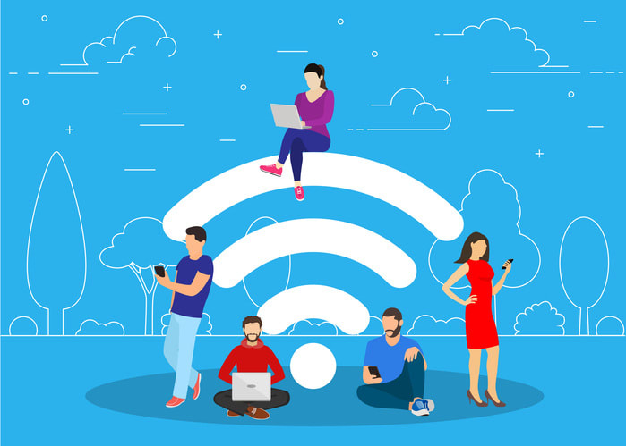 People in free internet zone using mobile gadgets