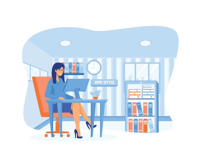 Woman sitting at table in room, looking at computer screen