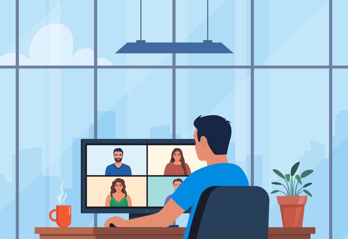 Worker using computer for collective virtual meeting